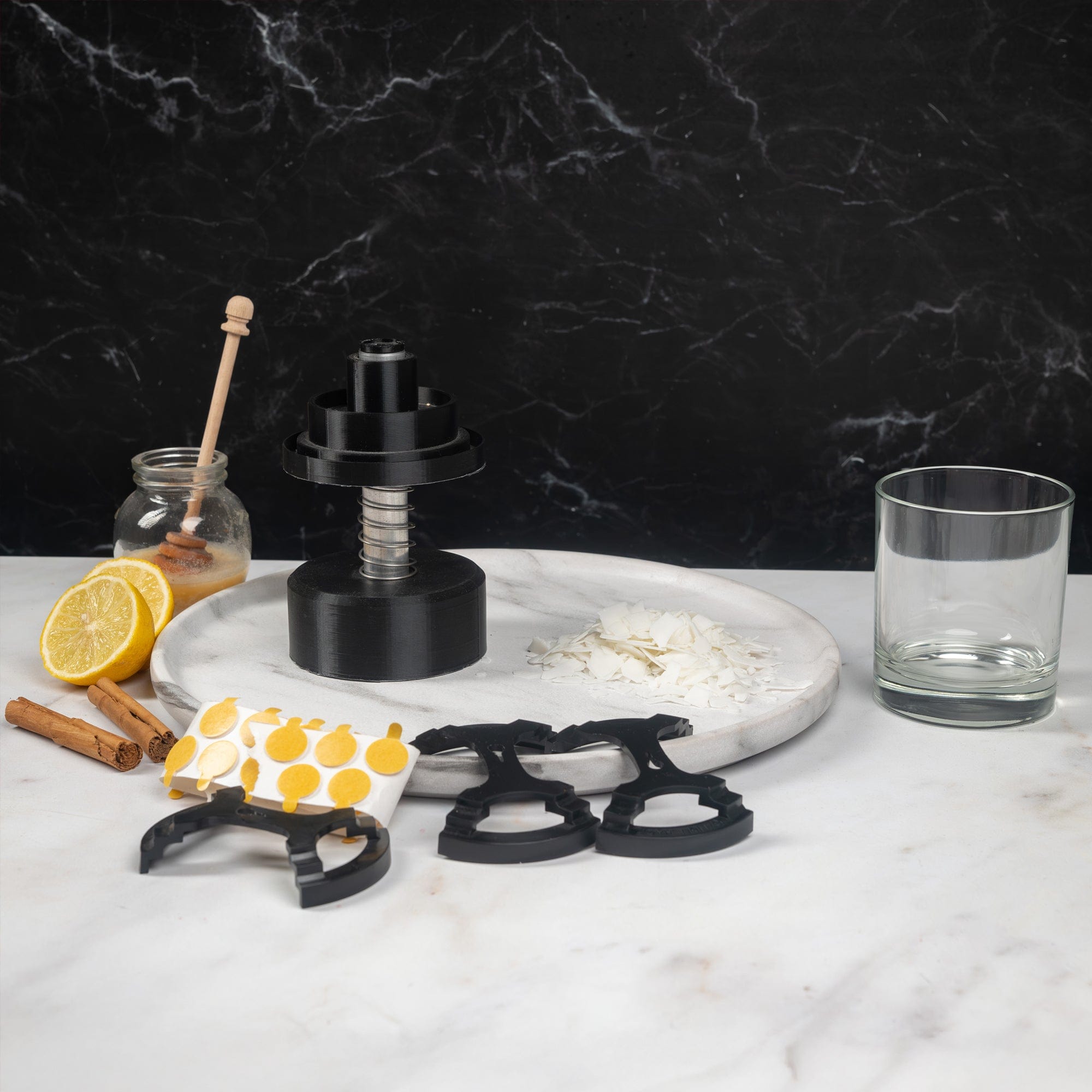 Starter Candle Making Kit Oriental And Citrus Starter Kit with its component on a marble backdrop