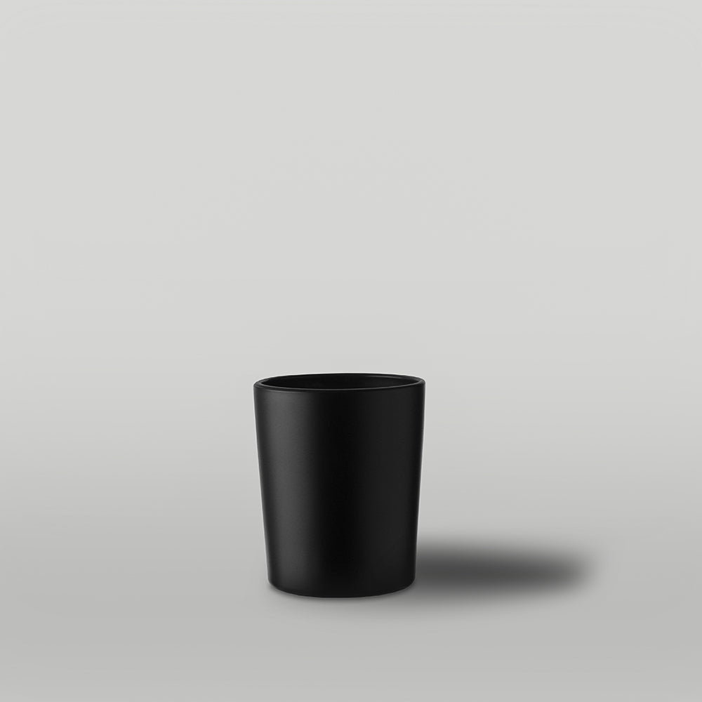 9cl matt black Lotti candle jar on a grey background