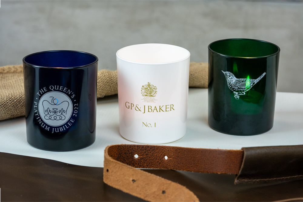 Three customised candle jars with screen-printed or laser-etched logos
