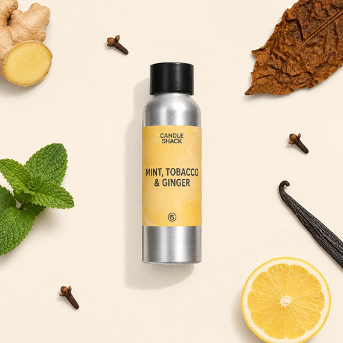 Candle Shack fragrance bottle labeled 'Mint Ginger and Tobacco' surrounded by ginger, cloves, and vanilla beans on a beige background.