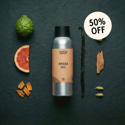 Candle Shack Amara Sol fragrance oil with ingredients on a dark surface and 50% off label.
