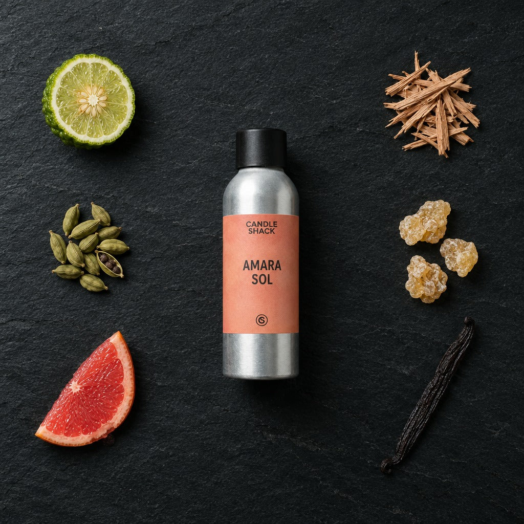 Amara Sol fragrance oil - Candle Shack aluminium bottle with dried botanicals on a dark slate background