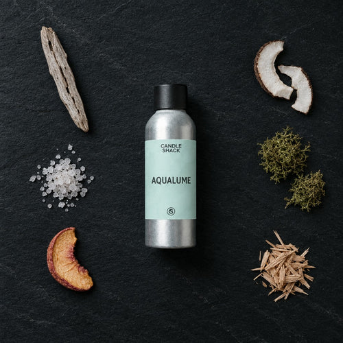 AquaLume fragrance oil - Candle Shack aluminium bottle with dried botanicals on a dark slate background