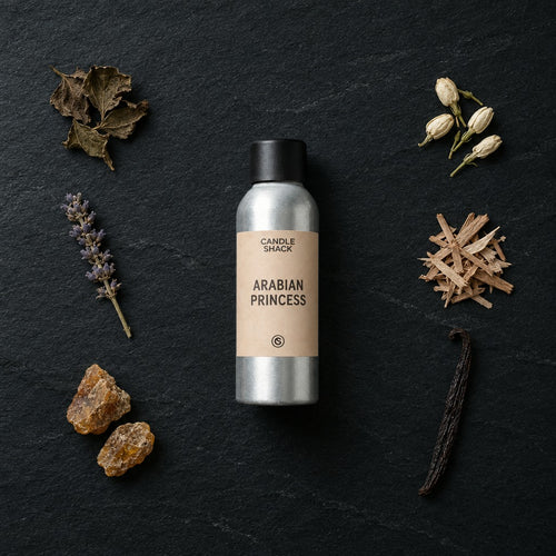 Arabian Princess fragrance oil - Candle Shack aluminium bottle with dried botanicals on a dark slate background
