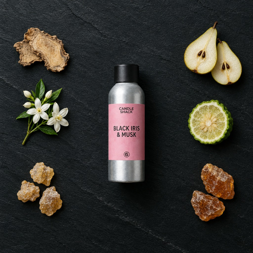 Black Iris & Musk fragrance oil - Candle Shack aluminium bottle with dried botanicals on a dark slate background