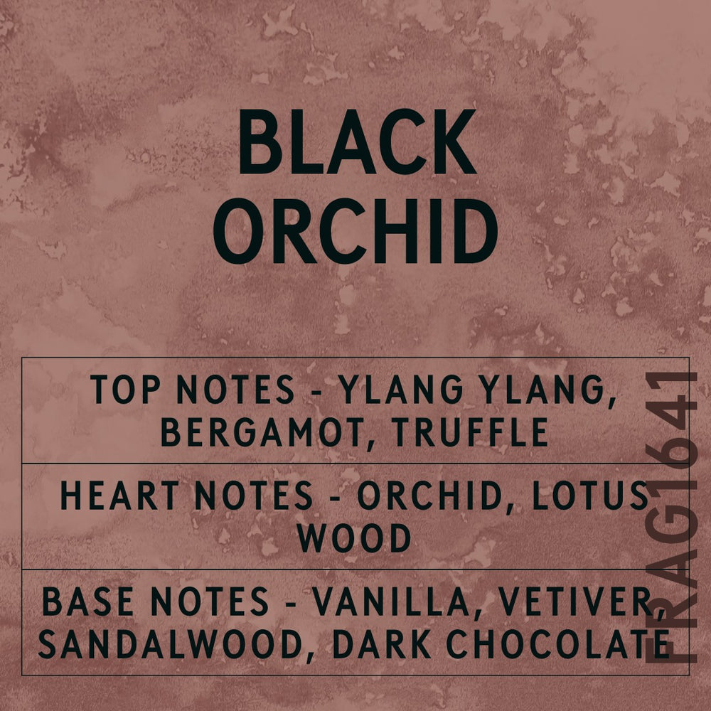 Black Orchid fragrance oil - Candle Shack aluminium bottle with dried botanicals on a dark slate background