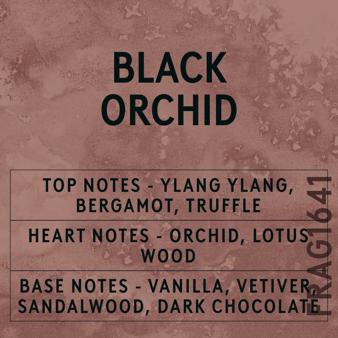 Black Orchid fragrance oil - Candle Shack aluminium bottle with dried botanicals on a dark slate background
