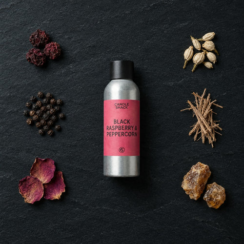 Black Raspberry & Peppercorn fragrance oil - Candle Shack aluminium bottle with dried botanicals on a dark slate background
