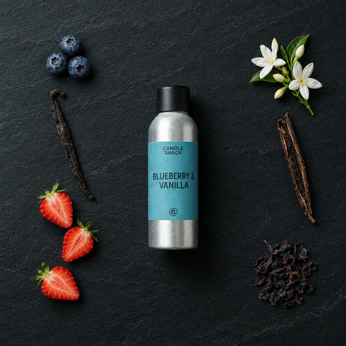 Blueberry & Vanilla fragrance oil - Candle Shack aluminium bottle with dried botanicals on a dark slate background