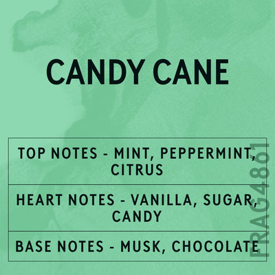 Candy Cane fragrance oil - Candle Shack aluminium bottle with dried botanicals on a dark slate background