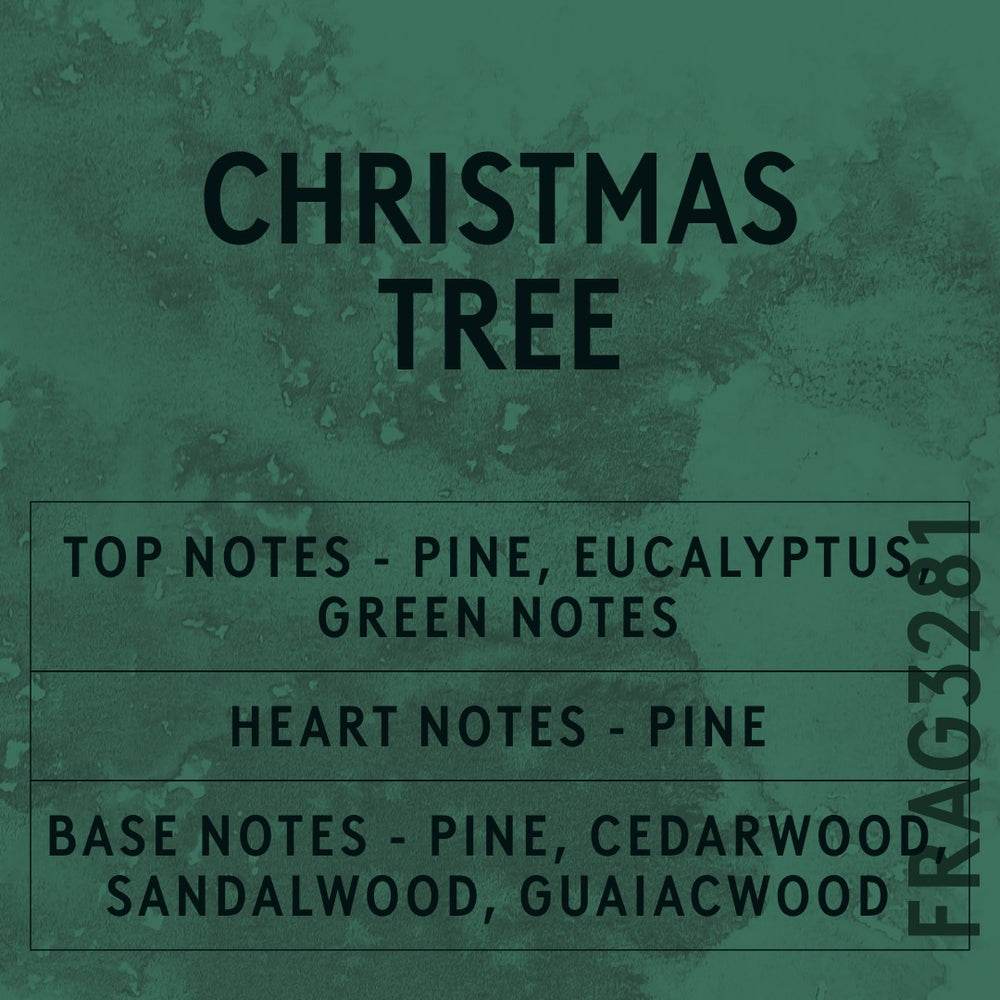 Christmas Tree fragrance oil - Candle Shack aluminium bottle with dried botanicals on a dark slate background