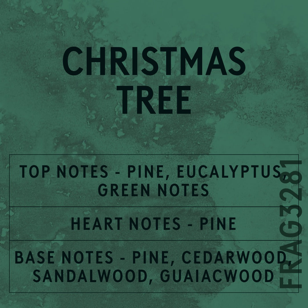 Christmas Tree fragrance oil - Candle Shack aluminium bottle with dried botanicals on a dark slate background