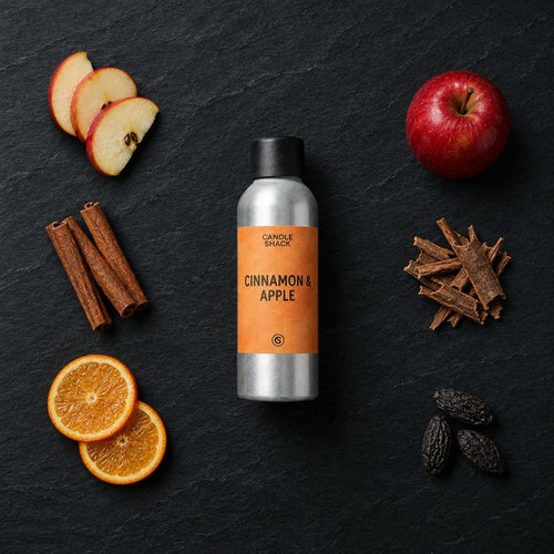 Cinnamon and Apple fragrance oil - Candle Shack aluminium bottle with dried botanicals on a dark slate background