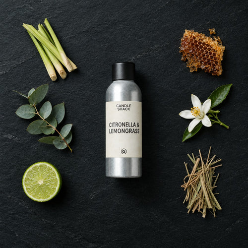 Citronella & Lemongrass Natural Oil with Citrepel Insect Repellent fragrance oil - Candle Shack aluminium bottle with dried botanicals on a dark slate background