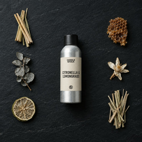 Citronella & Lemongrass Natural Oil with Citrepel Insect Repellent fragrance oil - Candle Shack aluminium bottle with dried botanicals on a dark slate background