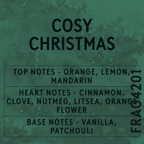 Cosy Christmas fragrance oil - Candle Shack aluminium bottle with dried botanicals on a dark slate background