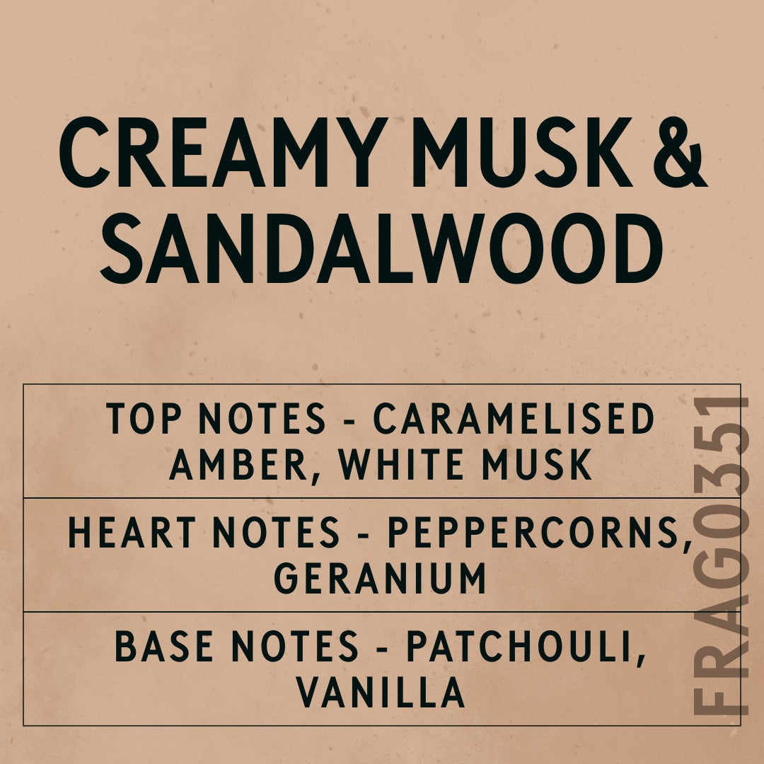 Creamy Musk and Sandalwood fragrance oil - Candle Shack aluminium bottle with dried botanicals on a dark slate background