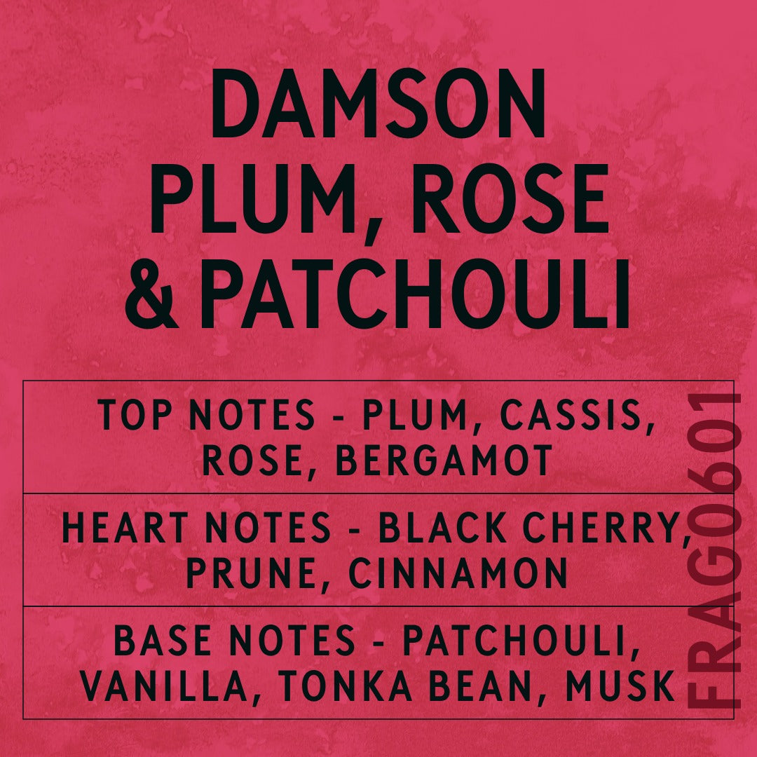 Damson Plum, Rose & Patchouli fragrance oil - Candle Shack aluminium bottle with dried botanicals on a dark slate background