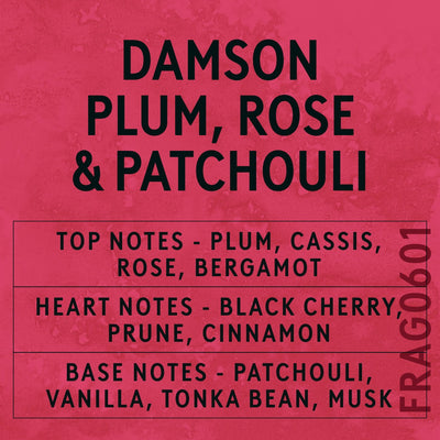 Damson Plum, Rose & Patchouli fragrance oil - Candle Shack aluminium bottle with dried botanicals on a dark slate background