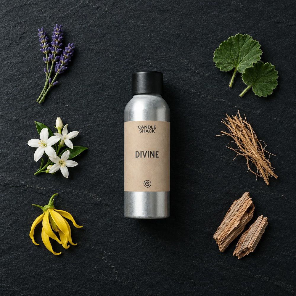 Divine Natural Oil fragrance oil - Candle Shack aluminium bottle with dried botanicals on a dark slate background