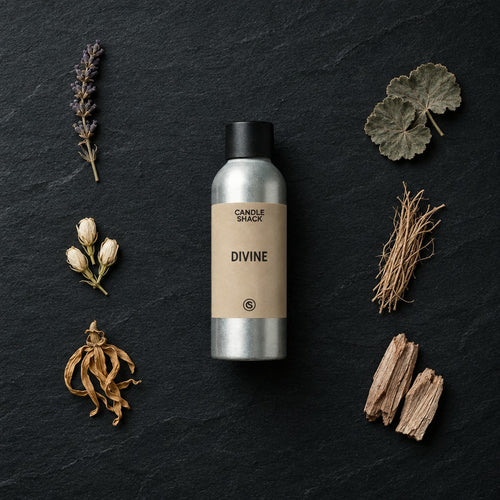 Divine Natural Oil fragrance oil - Candle Shack aluminium bottle with dried botanicals on a dark slate background