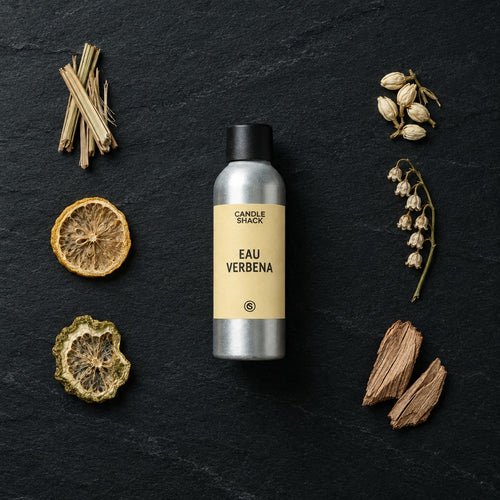 Eau Verbena fragrance oil - Candle Shack aluminium bottle with dried botanicals on a dark slate background