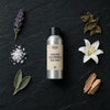 English Lavender & Dead Sea Minerals fragrance oil - Candle Shack aluminium bottle with dried botanicals on a dark slate background