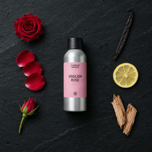 English Rose fragrance oil - Candle Shack aluminium bottle with dried botanicals on a dark slate background