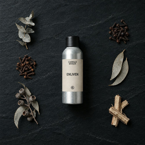 Enliven Natural Oil fragrance oil - Candle Shack aluminium bottle with dried botanicals on a dark slate background