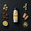 Frankincense & Myrrh fragrance oil - Candle Shack aluminium bottle with dried botanicals on a dark slate background