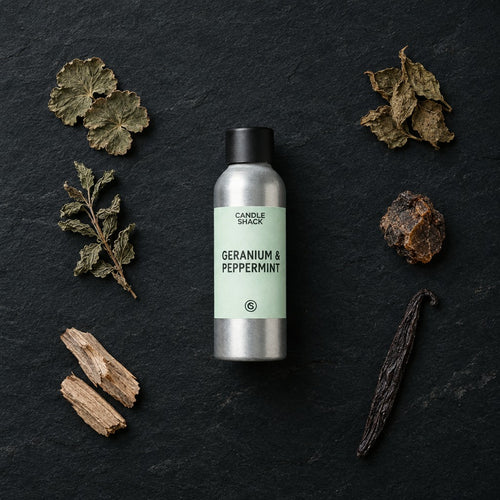 Geranium & Peppermint with Citrepel Insect Repellent fragrance oil - Candle Shack aluminium bottle with dried botanicals on a dark slate background
