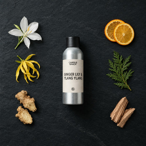 Ginger Lily & Ylang Ylang Oil fragrance oil - Candle Shack aluminium bottle with dried botanicals on a dark slate background