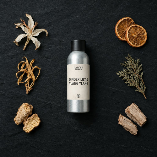Ginger Lily & Ylang Ylang Oil fragrance oil - Candle Shack aluminium bottle with dried botanicals on a dark slate background