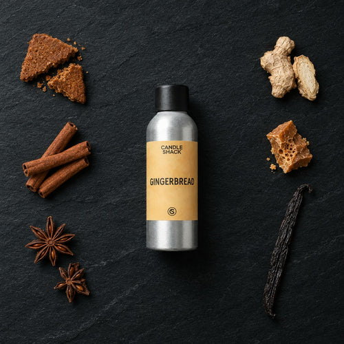 Gingerbread fragrance oil - Candle Shack aluminium bottle with dried botanicals on a dark slate background