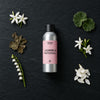 Jasmine & Patchouli fragrance oil - Candle Shack aluminium bottle with dried botanicals on a dark slate background