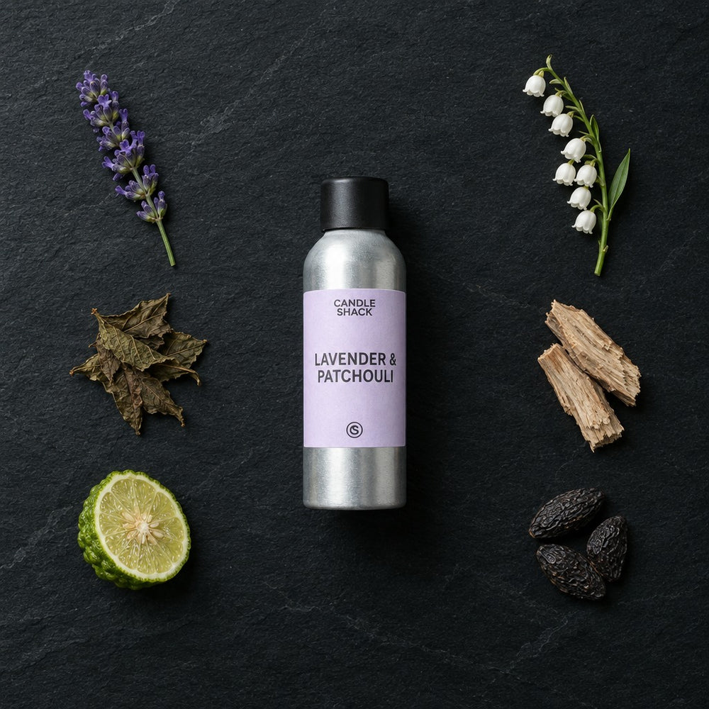 Lavender & Patchouli with Citrepel Insect Repellent fragrance oil - Candle Shack aluminium bottle with dried botanicals on a dark slate background