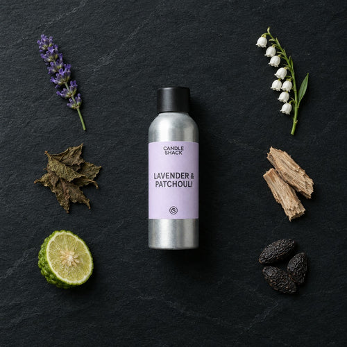 Lavender & Patchouli with Citrepel Insect Repellent fragrance oil - Candle Shack aluminium bottle with dried botanicals on a dark slate background