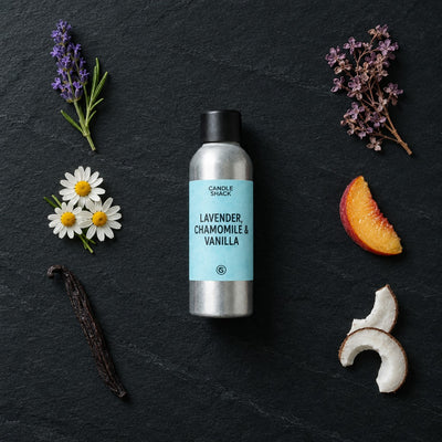 Lavender, Chamomile & Vanilla fragrance oil - Candle Shack aluminium bottle with dried botanicals on a dark slate background