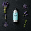 Lavender Spa fragrance oil - Candle Shack aluminium bottle with dried botanicals on a dark slate background