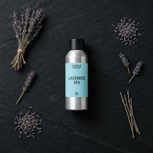Lavender Spa fragrance oil - Candle Shack aluminium bottle with dried botanicals on a dark slate background