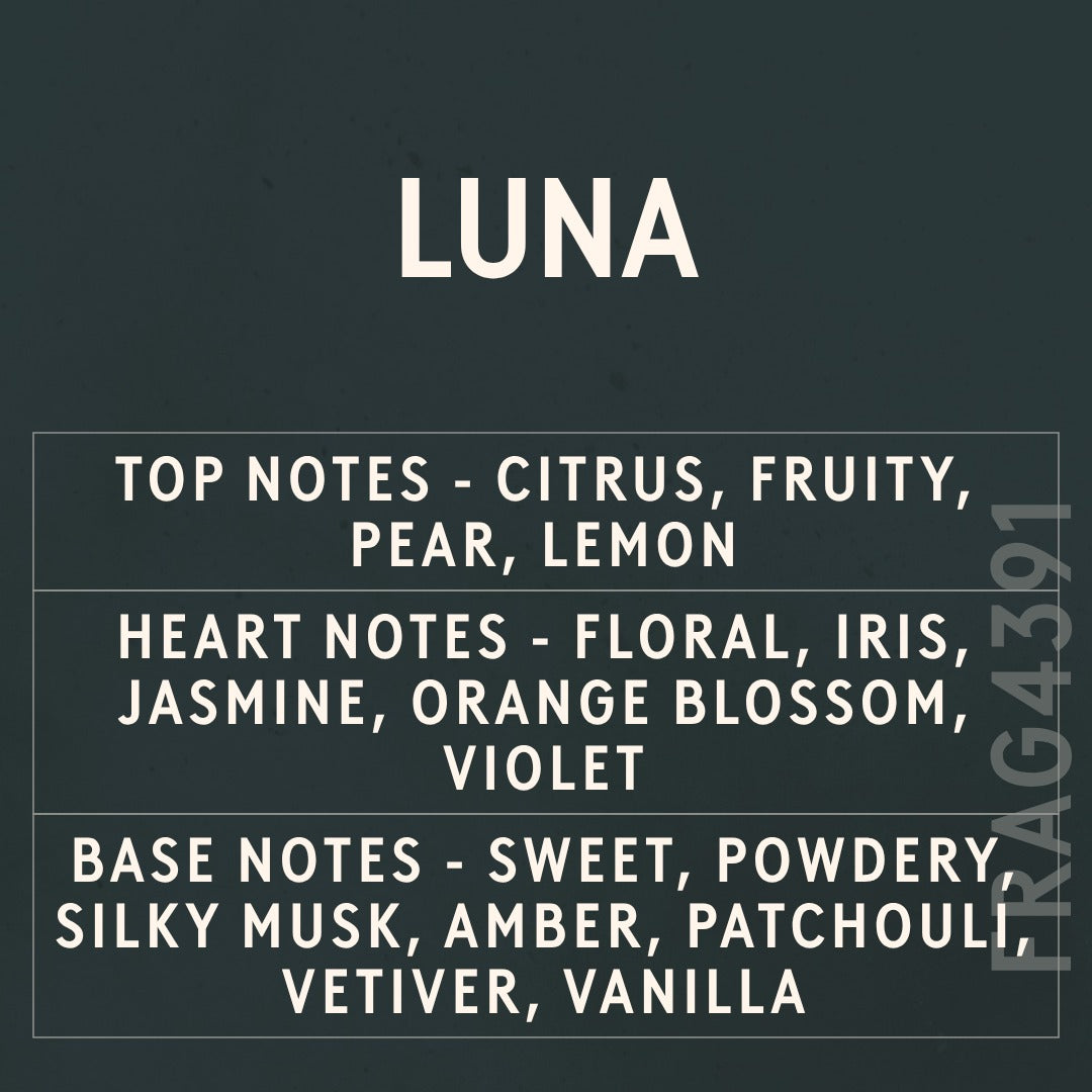 Luna fragrance oil - Candle Shack aluminium bottle with dried botanicals on a dark slate background