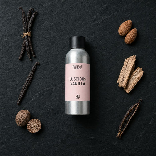 Luscious Vanilla fragrance oil - Candle Shack aluminium bottle with dried botanicals on a dark slate background