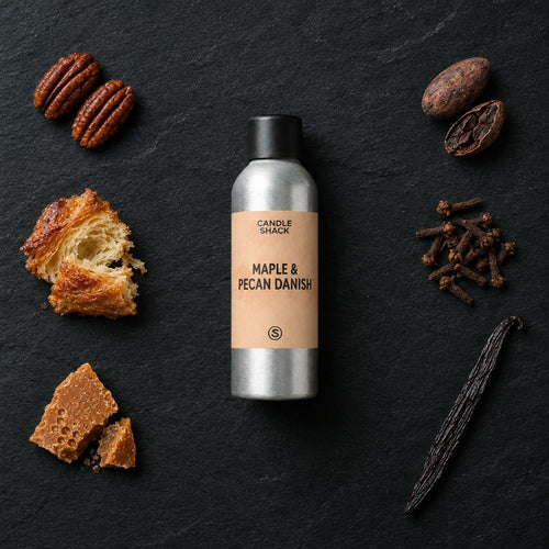 Maple & Pecan Danish fragrance oil - Candle Shack aluminium bottle with dried botanicals on a dark slate background