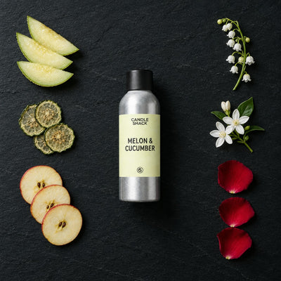 Melon & Cucumber fragrance oil - Candle Shack aluminium bottle with dried botanicals on a dark slate background