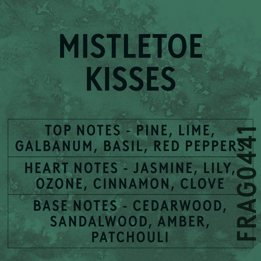 Mistletoe Kisses fragrance oil - Candle Shack aluminium bottle with dried botanicals on a dark slate background