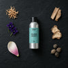 Mojave Desert fragrance oil - Candle Shack aluminium bottle with dried botanicals on a dark slate background