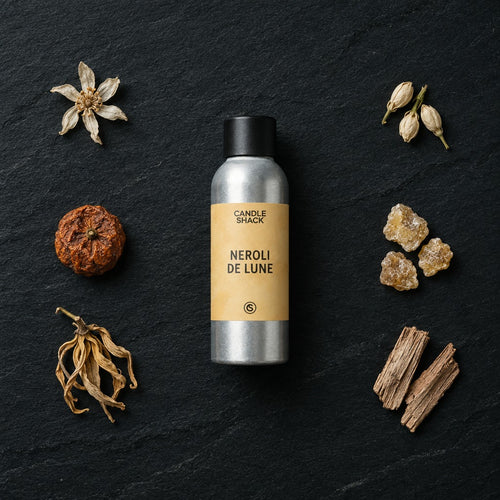 Neroli De Lune fragrance oil - Candle Shack aluminium bottle with dried botanicals on a dark slate background