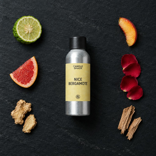 Nice Bergamote fragrance oil - Candle Shack aluminium bottle with dried botanicals on a dark slate background