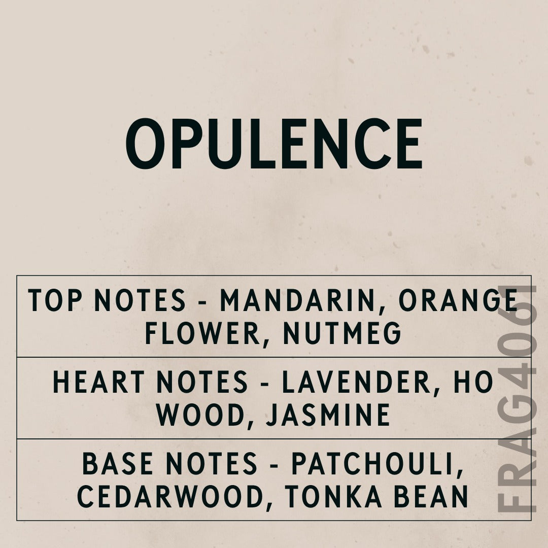 Opulence Natural Oil fragrance oil - Candle Shack aluminium bottle with dried botanicals on a dark slate background