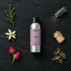 Otto fragrance oil - Candle Shack aluminium bottle with dried botanicals on a dark slate background